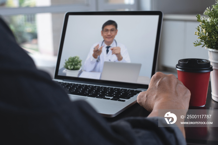 Doctor explaining to patient via laptop computer for telemedicine and medical online Ehealth concept