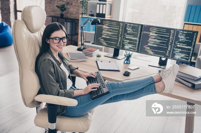 Portrait of attractive cheerful girl web developer tech support service providing intranet network at workplace workstation indoors