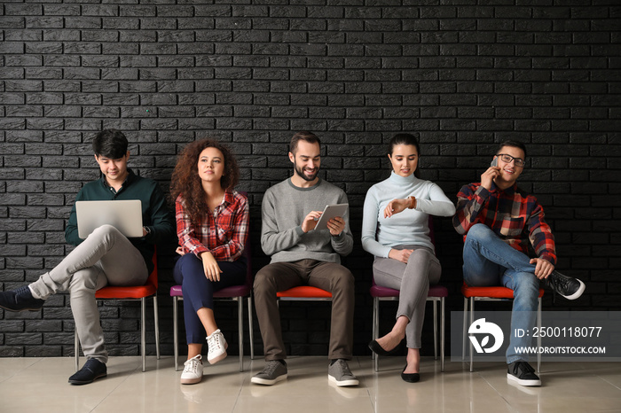 Young people waiting for job interview indoors