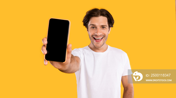 Man showing white blank smartphone screen close to camera