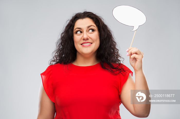 party props, photo booth and communication concept - happy woman in red dress holding big blank speech bubble over grey background