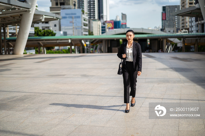 business woman walking in city