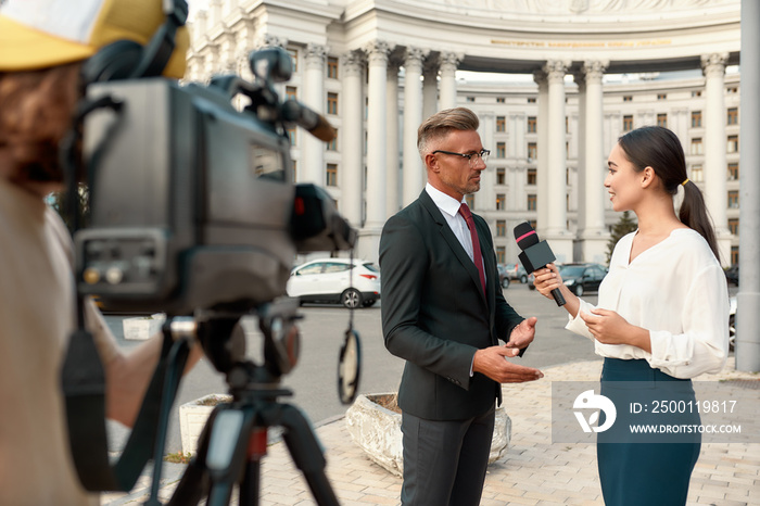 Journalism that is independent, honest, and dignified. Cameraman and news reporter interviewing politician. Journalism industry, live streaming concept.