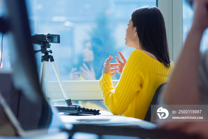 Giving advice. Beautiful young woman smiling while making social media video, Recording her self and streaming to online platform.