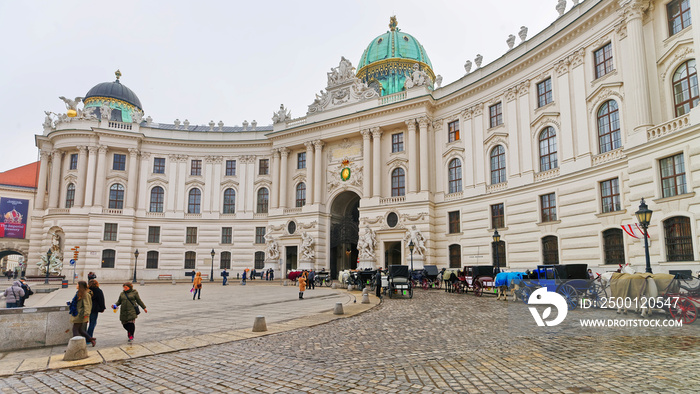 People at St Michael Wing of Hofburg Palace in Vienna