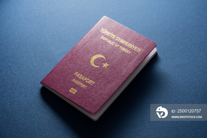 Turkish citizen public passport on the blue background.