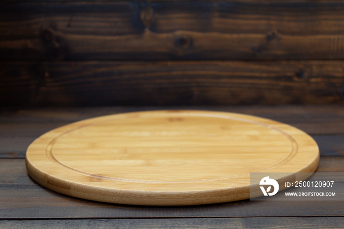 pizza cutting board at wooden table