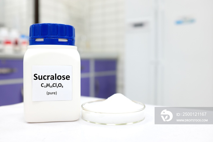 Selective focus of a bottle of pure sucralose artificial sweetener sugar substitute. White laboratory background with copy space.