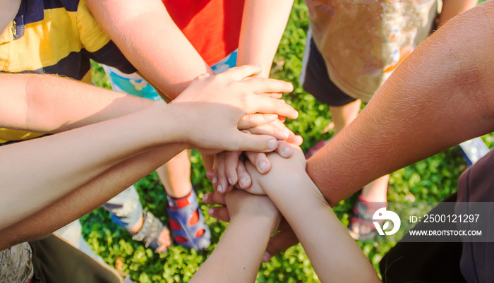 hands of children, many friends, games. Selective focus.