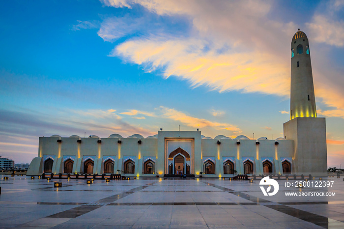 Qatar State Mosque  (Imam Muhammad ibn Abd al-Wahhab Mosque) exterior view at sunset with clouds in the sky