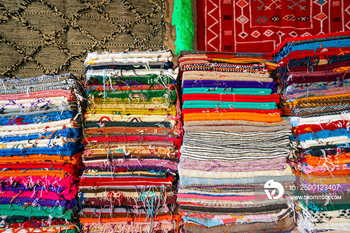 Plenty of famous traditional Berber carpets on sale, in Morocco