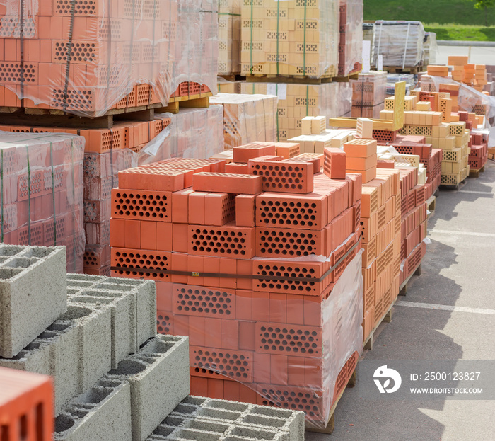 Building bricks and other construction materials on an outdoor warehouse