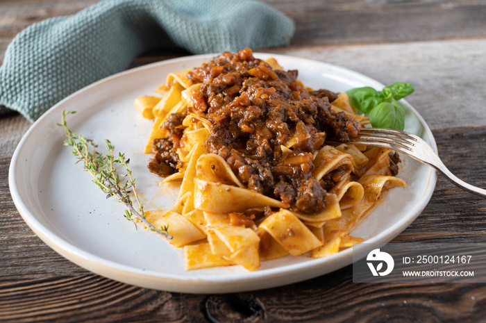 Duck ragout alla bolognese with pasta on a plate