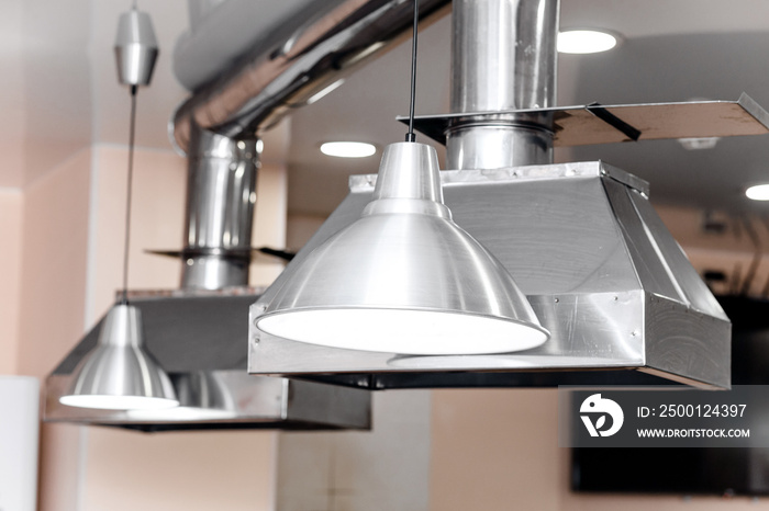 Elegant stainless steel kitchen extractor fan in restaurant cooking room