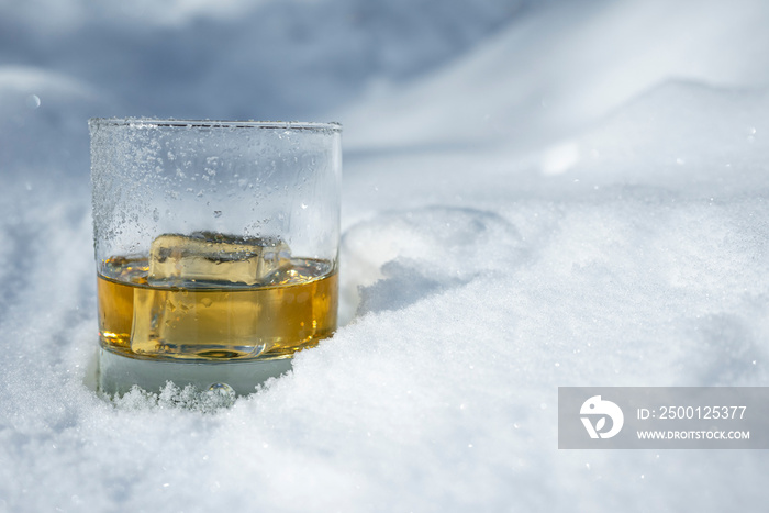 Whiskey on the rocks in the snow