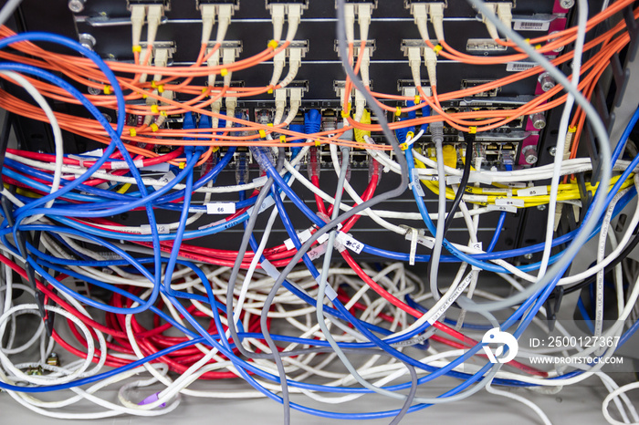 cable network in server room cable tangled of poorly routed cables Concept Organized Cabling in server rooms