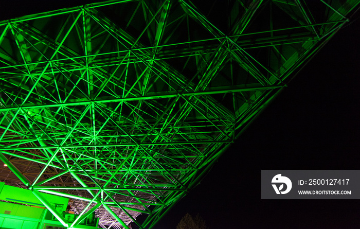 Green Steel infrastructure with lights and black background