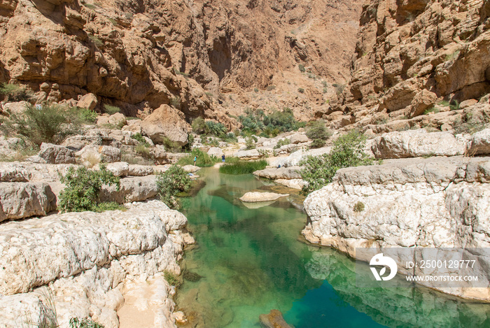 Tiwi, Oman - famous of its vertical cliffs and the green water, Wadi Shab is one of the most beautiful wadi in Oman, and a very popular tourist destination