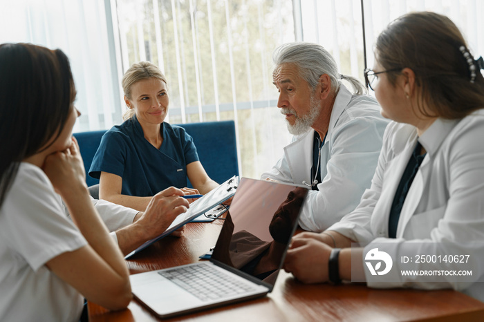 Successful medical doctors are discussing diagnosis during the conference