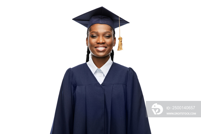 education, graduation and people concept - portrait of happy graduate student woman in mortarboard and bachelor gown