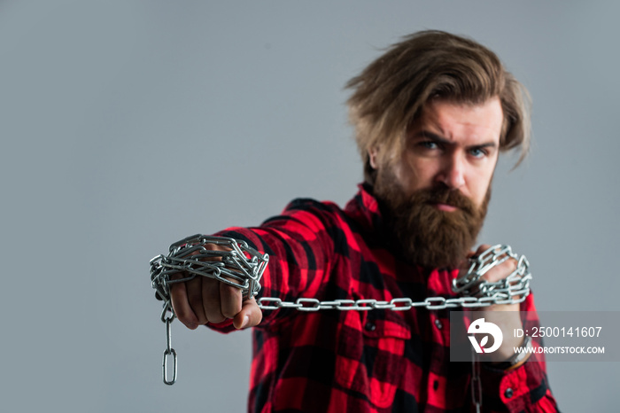 Brutal bearded man pull steel chain, Break the vicious circle