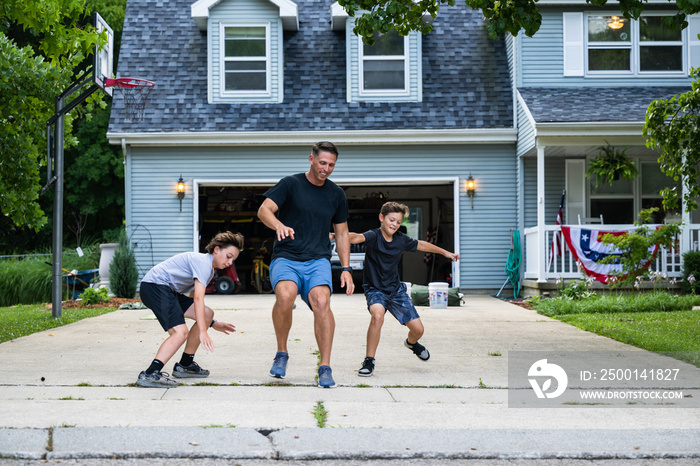 Air Force service member trains with his sons in a morning workout in preperation for a PT fitness test.