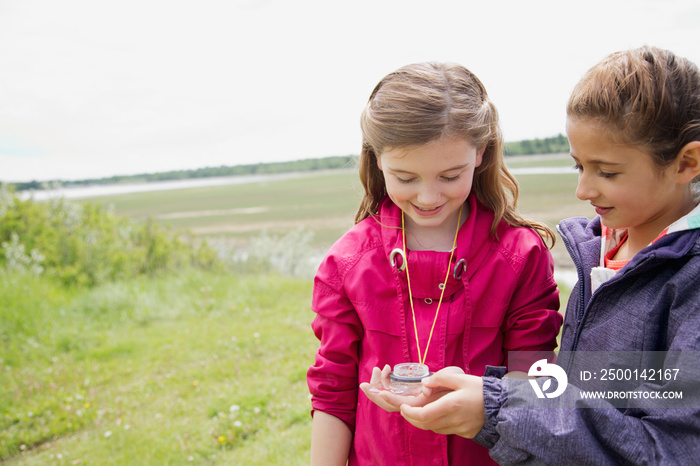 elementary students using compass outdoors