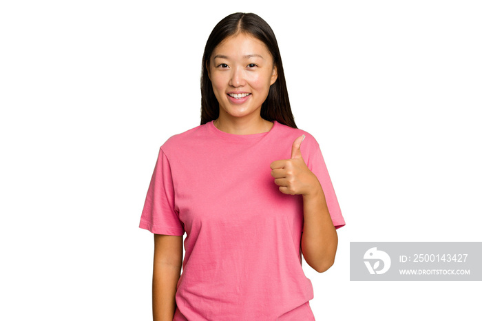 Young Asian woman isolated on green chroma background smiling and raising thumb up