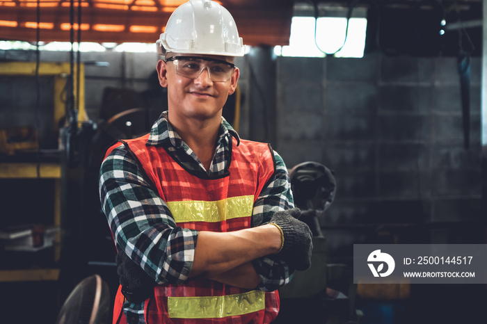 Young factory job worker or engineer close up portrait in manufacturing factory . Industry and engineering concept .