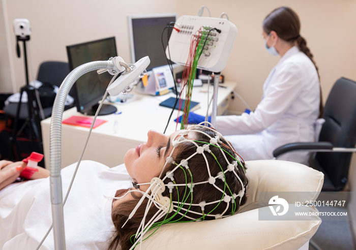 Patient brain testing using encephalography at medical center