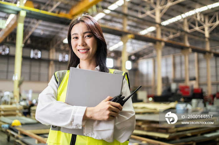 Asian beautiful woman industrial worker working in manufacturing plant