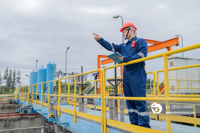 Water plant maintenance technicians, mechanical engineers check the control system at the water treatment plant.