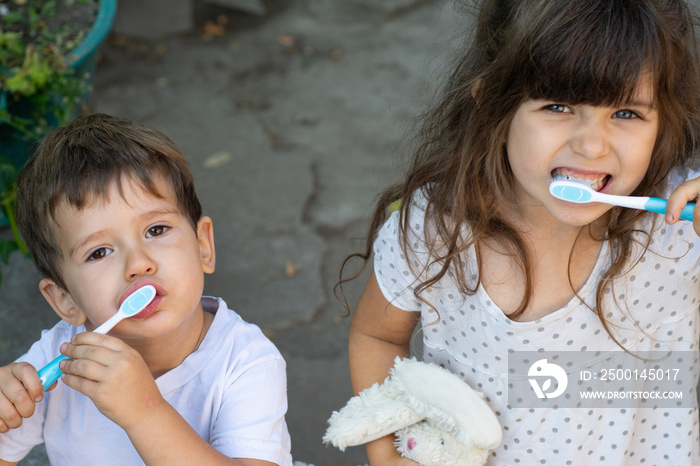 Children brushing teeth.