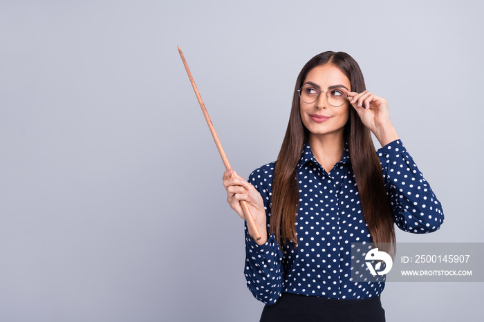 Portrait of attractive cheery businesswoman pointing copy space academic science isolated over grey color background