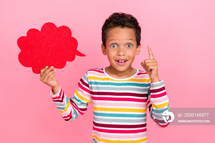 Photo of smart boy hold shiny paper cloud massage comment feedback brilliant excellent answer empty space isolated on pink color background