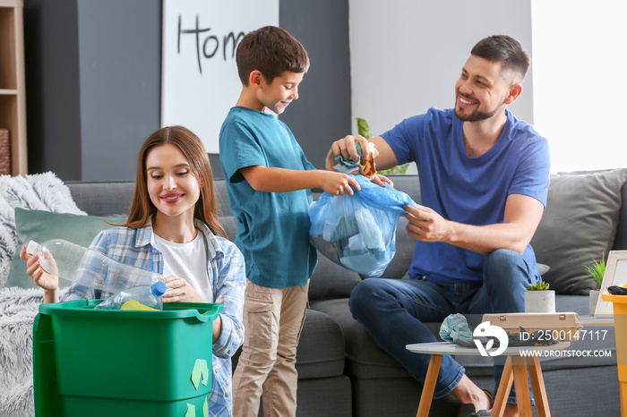 Family sorting garbage at home. Concept of recycling