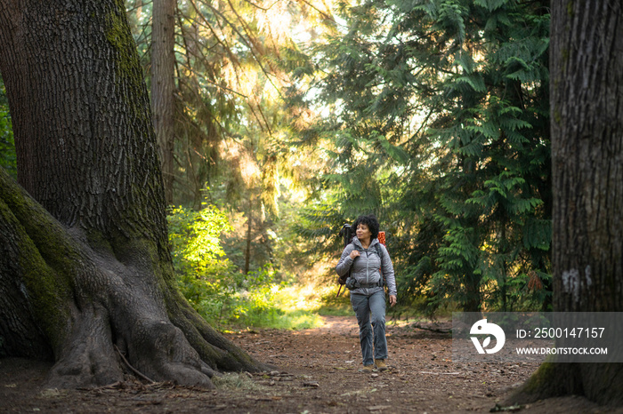 U.S. Army female soldier putting in the miles with an early morning hike in the NorthWest.