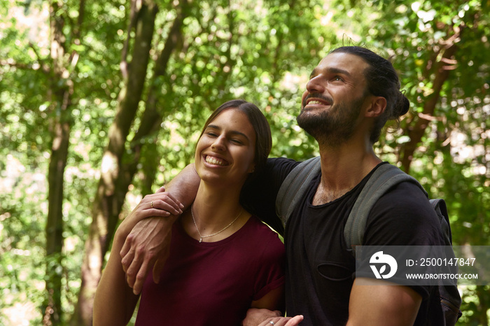 Young couple holding each other in a forest