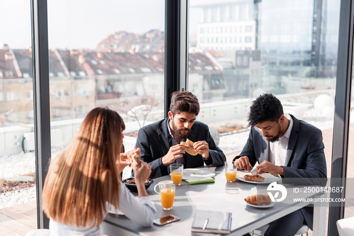 Business people having breakfast