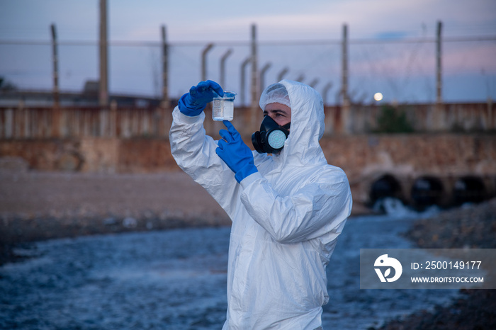 Worker under checking the waste water treatment pond industry large to control water support industry