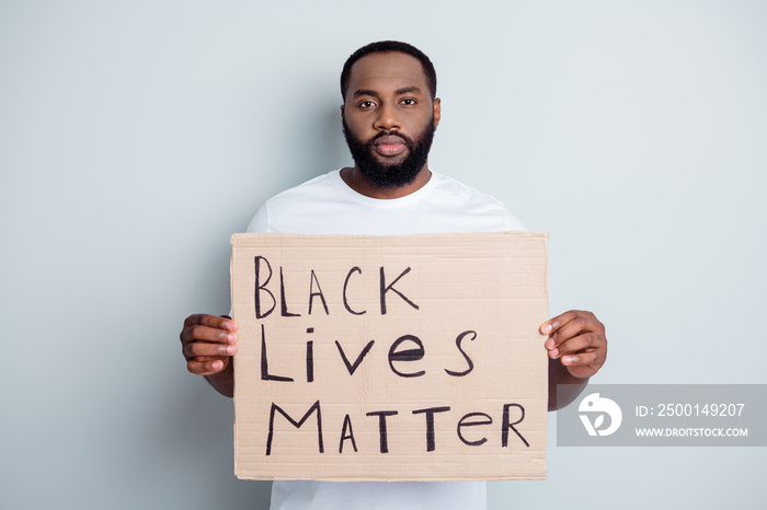 Black lives matter. Photo of serious disappointed dark skin african protester placard community against black citizens lawlessness stop murder people concept isolated grey color background