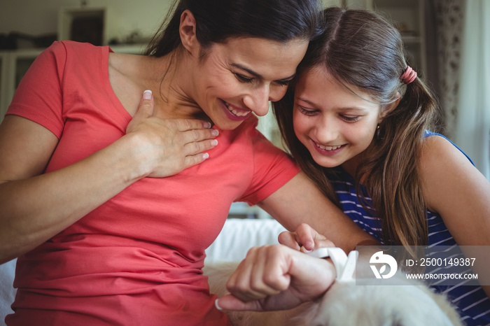 Mother and daughter checking the smart watch