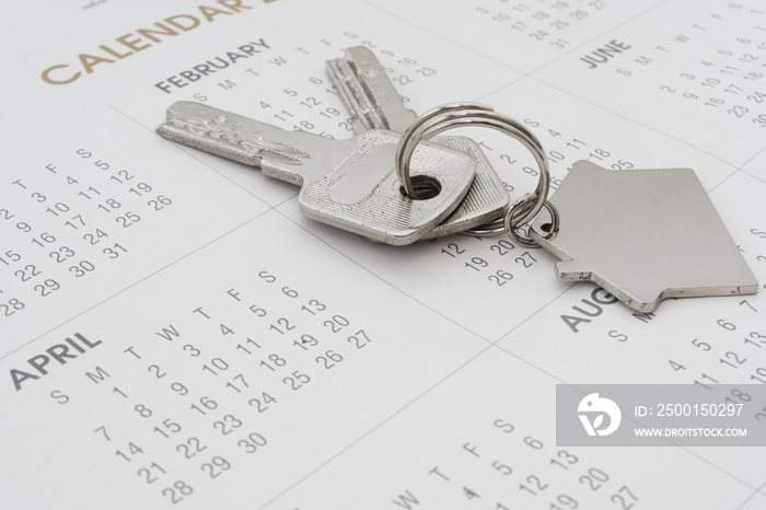 House keys on calendar background