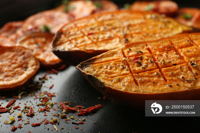 Tasty baked sweet potato on plate, closeup