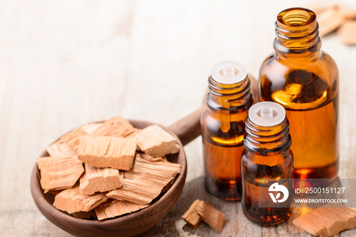 Sandalwood essential oil on the wooden board