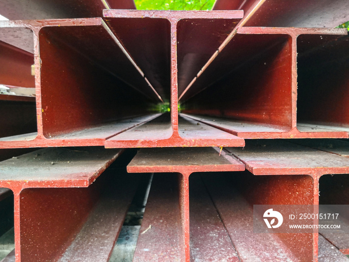 Pile of steel beam paint red color preparing for structure construction