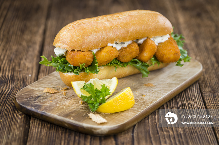 Roll with fried Fish Sticks (close-up shot)