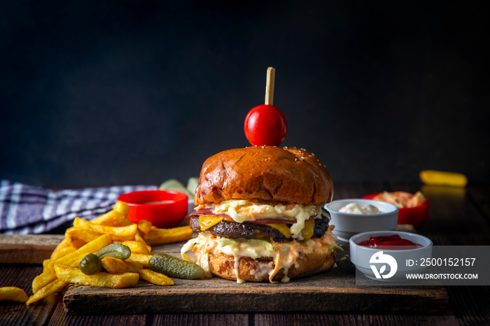 Homemade hamburger is prepared with coleslaw sauce and there are cheese varieties in it.