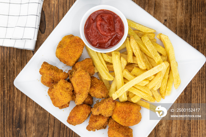 Vintage wooden table with fresh made Chicken Nuggets