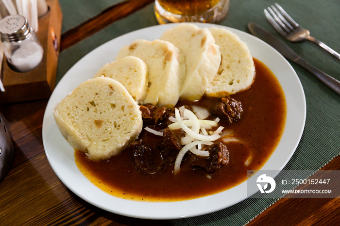 Tasty beef goulash with potato dumplings. Czech cuisine